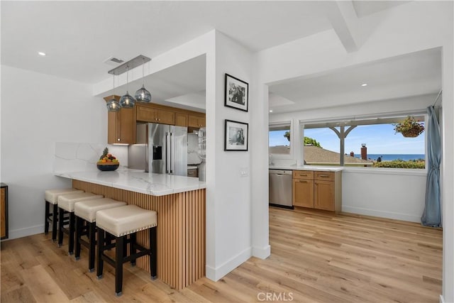 416 Via Pichon, San Clemente, CA 92672 - kitchen featuring stainless steel appliances, light wood-style flooring, a breakfast bar, and recessed lighting