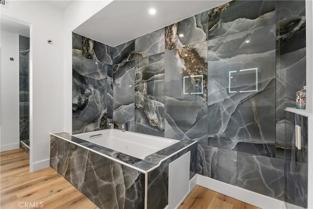 416 Via Pichon, San Clemente, CA 92672 - full bath featuring wood finished floors, a bath, a marble finish shower, and tile walls