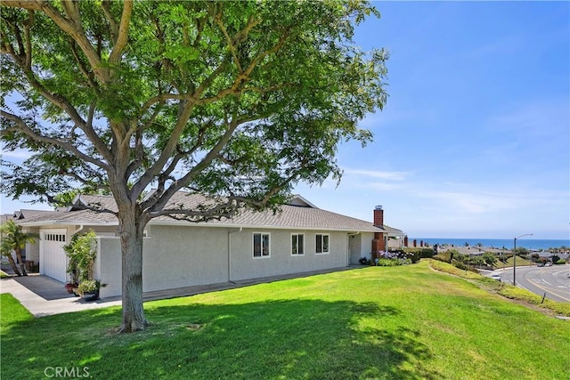416 Via Pichon, San Clemente, CA 92672 - view of home's exterior featuring an attached garage, a lawn, stucco siding, and driveway