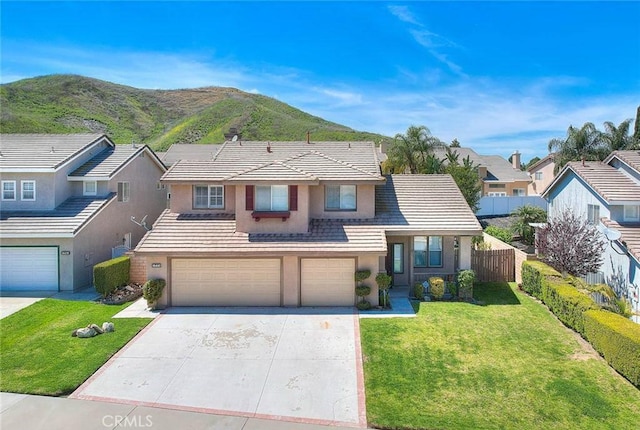 16410 Argent Rd, Chino Hills, CA 91709 - traditional home featuring an attached garage, concrete driveway, stucco siding, and a mountain view