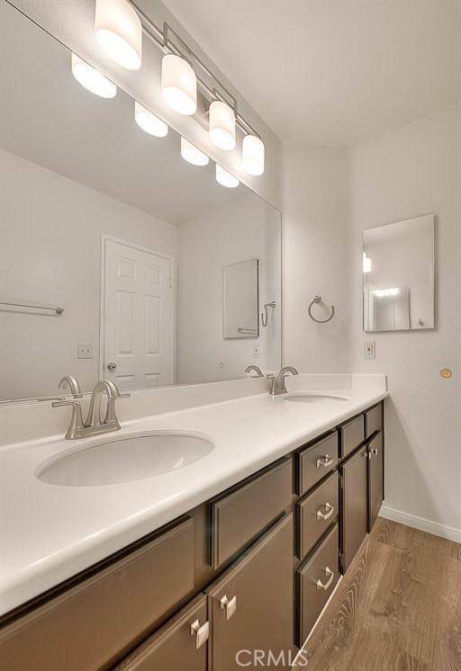 16410 Argent Rd, Chino Hills, CA 91709 - bathroom with double vanity and wood finished floors