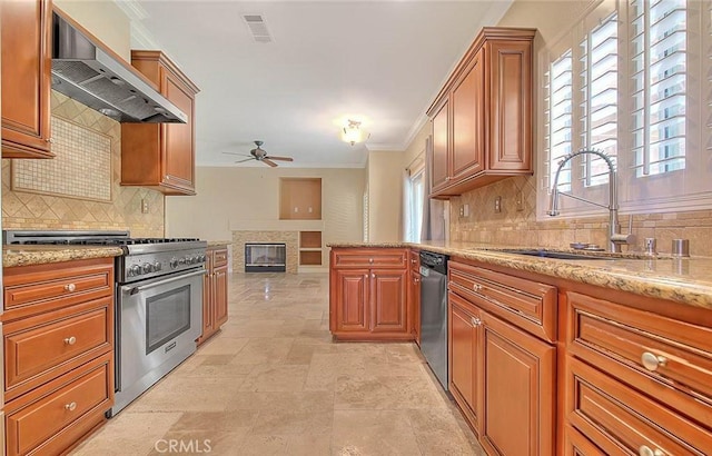 16410 Argent Rd, Chino Hills, CA 91709 - kitchen featuring appliances with stainless steel finishes, wall chimney exhaust hood, ceiling fan, ornamental molding, and a glass covered fireplace