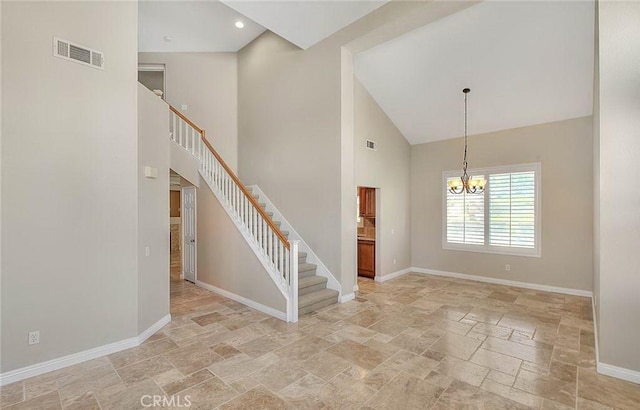 16410 Argent Rd, Chino Hills, CA 91709 - foyer featuring stone tile floors, high vaulted ceiling, stairway, and a chandelier