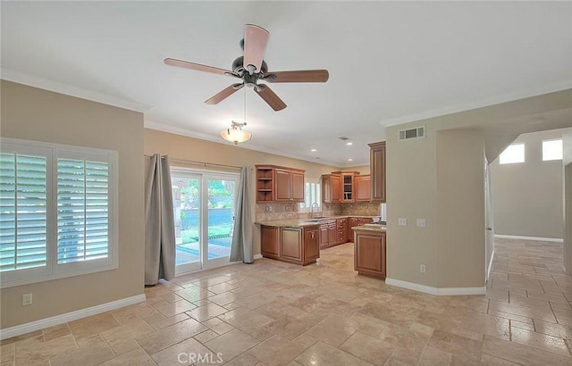 16410 Argent Rd, Chino Hills, CA 91709 - kitchen with brown cabinets, open shelves, stone tile flooring, ceiling fan, and ornamental molding