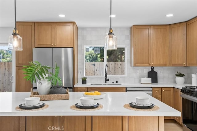 17978 Gallineta St, Rowland Heights, CA 91748 - kitchen featuring freestanding refrigerator, light countertops, black gas stove, decorative backsplash, and recessed lighting