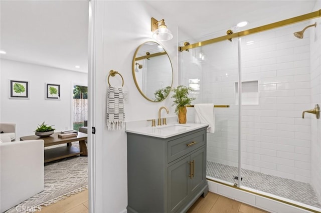 17978 Gallineta St, Rowland Heights, CA 91748 - bathroom featuring wood finished floors, vanity, a shower stall, and recessed lighting