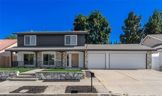 17978 Gallineta St, Rowland Heights, CA 91748 - traditional home featuring covered porch, stone siding, an attached garage, and concrete driveway