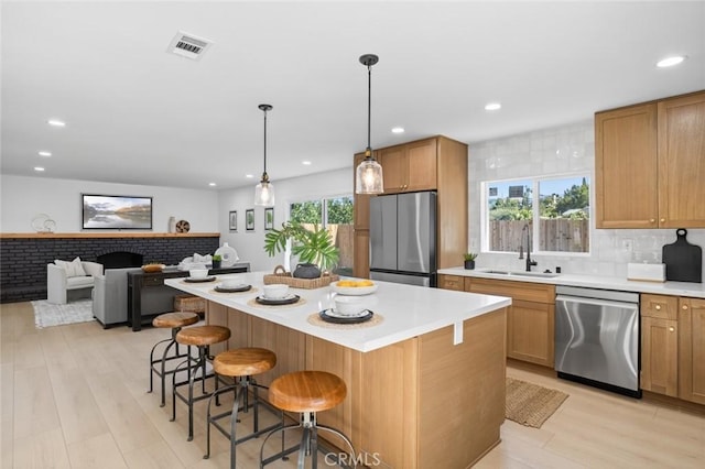 17978 Gallineta St, Rowland Heights, CA 91748 - kitchen with stainless steel appliances, a kitchen breakfast bar, light countertops, a kitchen island, and recessed lighting
