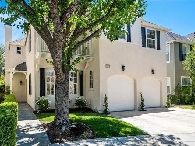 23808 Bayview Ct, Valencia, CA 91355 - mediterranean / spanish-style house with a garage, stucco siding, and driveway