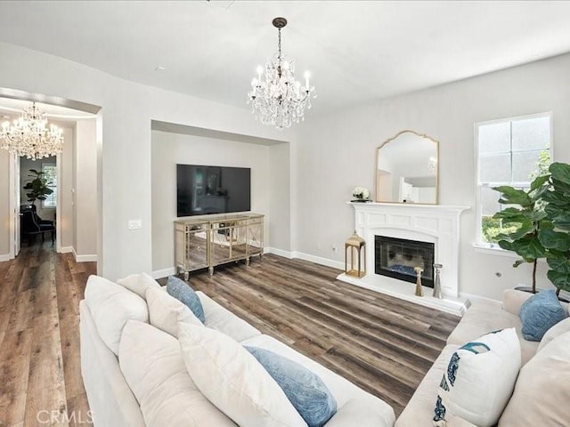23808 Bayview Ct, Valencia, CA 91355 - living room featuring a chandelier, wood finished floors, and a glass covered fireplace