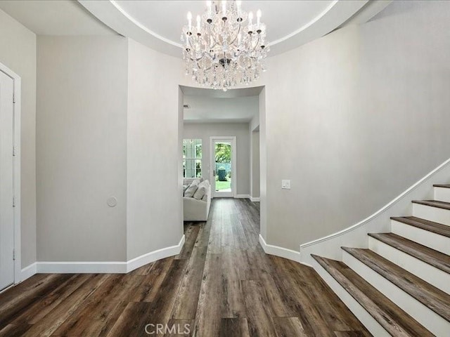 23808 Bayview Ct, Valencia, CA 91355 - hallway featuring wood finished floors, stairway, and a chandelier