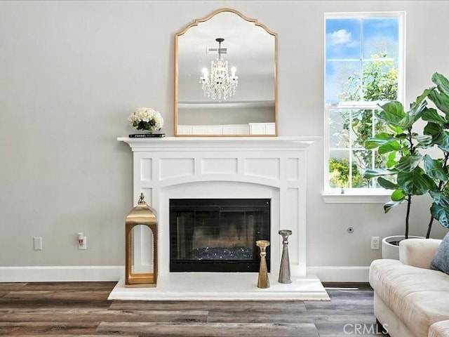 23808 Bayview Ct, Valencia, CA 91355 - living room with wood finished floors, a glass covered fireplace, a chandelier, and plenty of natural light