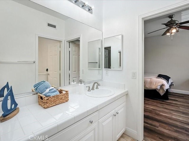 23808 Bayview Ct, Valencia, CA 91355 - ensuite bathroom featuring vanity, wood finished floors, and ceiling fan