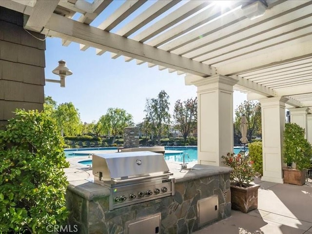 23808 Bayview Ct, Valencia, CA 91355 - view of patio / terrace with a pergola, an outdoor kitchen, and a community pool