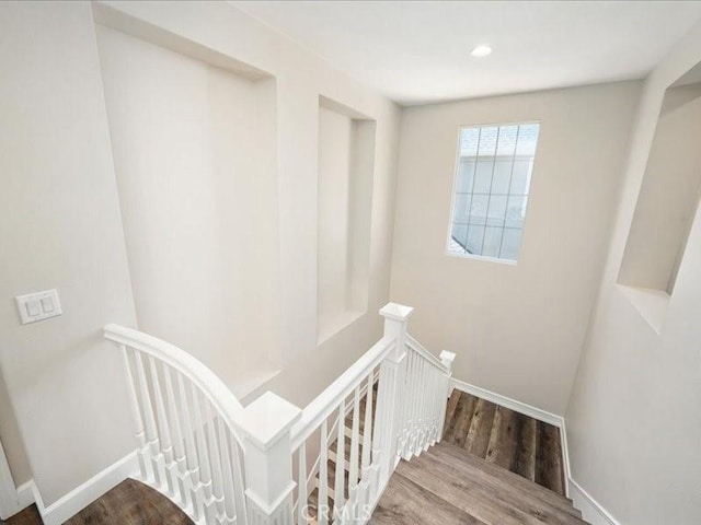 23808 Bayview Ct, Valencia, CA 91355 - staircase with wood finished floors and baseboards