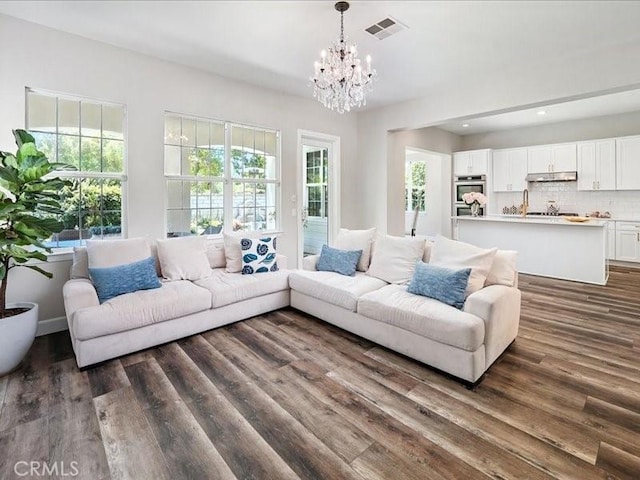 23808 Bayview Ct, Valencia, CA 91355 - living room with dark wood finished floors, a chandelier, and recessed lighting