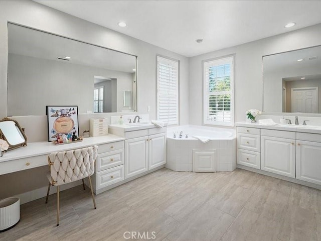 23808 Bayview Ct, Valencia, CA 91355 - full bathroom with two vanities, a garden tub, and recessed lighting