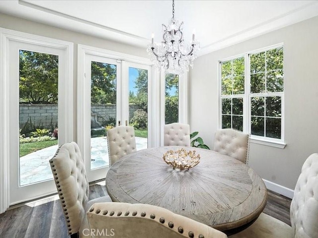 23808 Bayview Ct, Valencia, CA 91355 - dining space featuring a chandelier, wood finished floors, and healthy amount of natural light