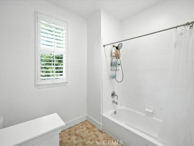 23808 Bayview Ct, Valencia, CA 91355 - bathroom with shower / tub combo and tile patterned floors