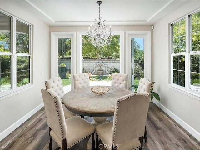 23808 Bayview Ct, Valencia, CA 91355 - dining space with a chandelier, dark wood finished floors, and a tray ceiling