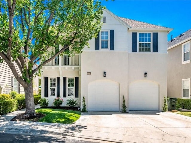 23808 Bayview Ct, Valencia, CA 91355 - view of front of home with a garage, stucco siding, concrete driveway, and a balcony