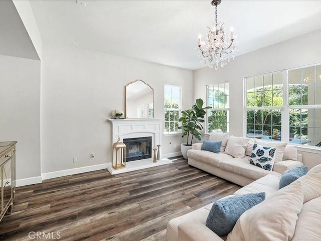 23808 Bayview Ct, Valencia, CA 91355 - living room featuring a chandelier, plenty of natural light, wood finished floors, and a fireplace with raised hearth