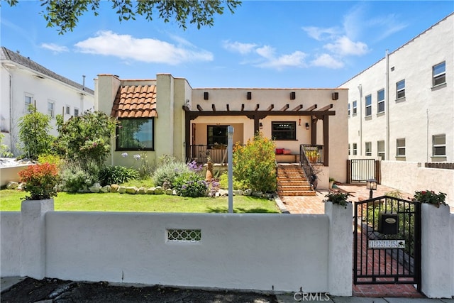 1215 S Patton Ave, San Pedro, CA 90731 - southwest-style home featuring a gate, a fenced front yard, stucco siding, a tiled roof, and stairs