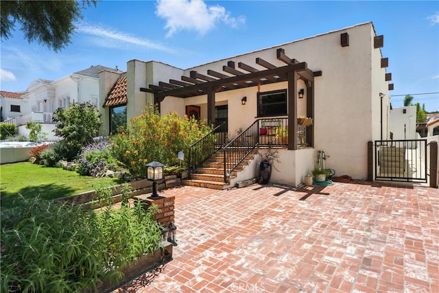 1215 S Patton Ave, San Pedro, CA 90731 - view of front of property featuring stucco siding, a pergola, and a patio