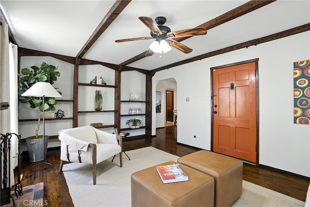 1215 S Patton Ave, San Pedro, CA 90731 - living area featuring arched walkways, dark wood-style floors, a ceiling fan, and beam ceiling