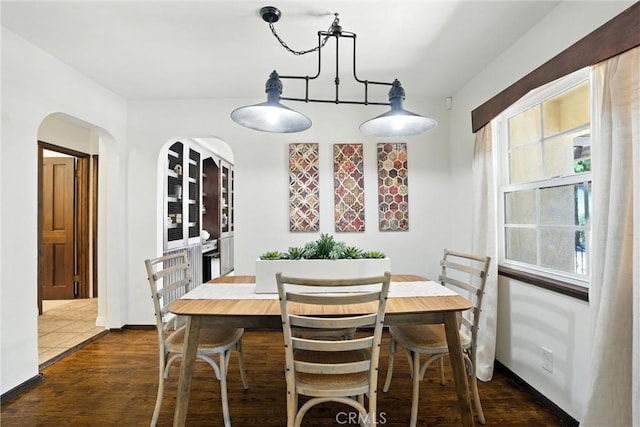 1215 S Patton Ave, San Pedro, CA 90731 - dining room with dark wood-type flooring and a chandelier