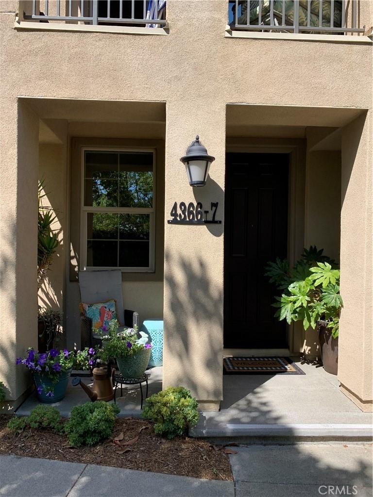 4366 Pacifica Way Unit 7, Oceanside, CA 92056 - view of exterior entry featuring stucco siding and a balcony
