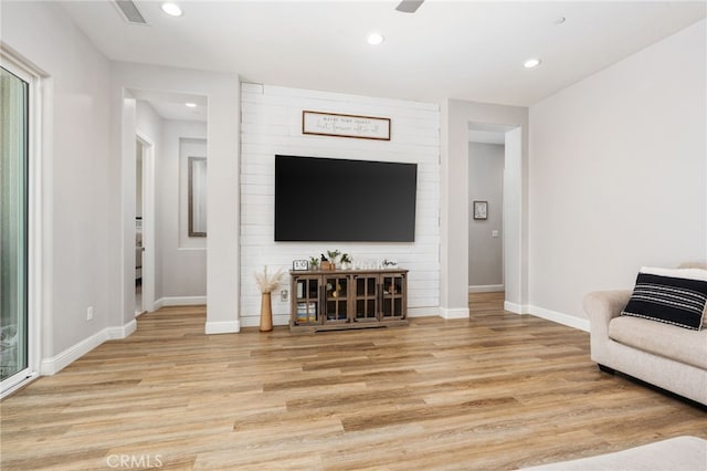 2070 Solig Ave, Kingsburg, CA 93631 - living area with light wood-style flooring and recessed lighting
