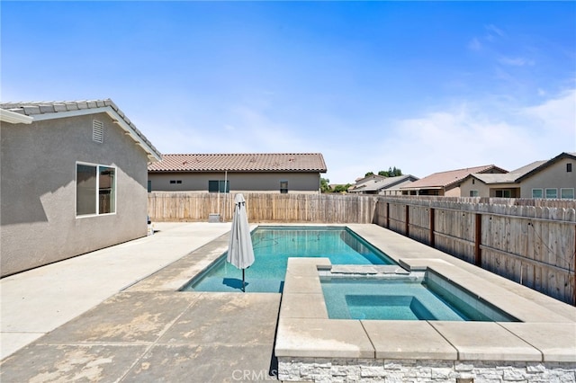 2070 Solig Ave, Kingsburg, CA 93631 - view of swimming pool featuring a patio area, a fenced backyard, and a pool with connected hot tub