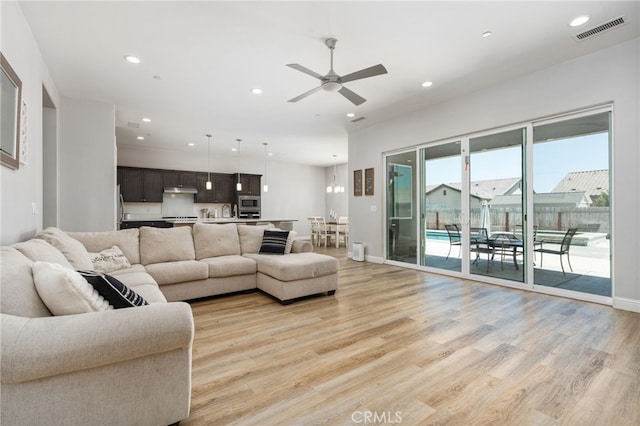 2070 Solig Ave, Kingsburg, CA 93631 - living room featuring ceiling fan, light wood finished floors, and recessed lighting