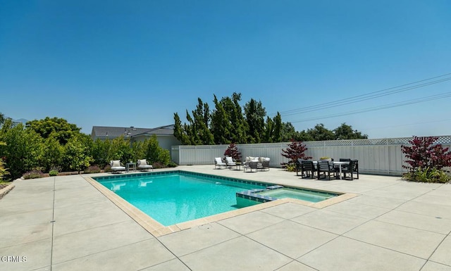 5210 La Canada Blvd, La Canada Flintridge, CA 91011 - view of swimming pool featuring a pool with connected hot tub, a patio area, a fenced backyard, and outdoor dining space