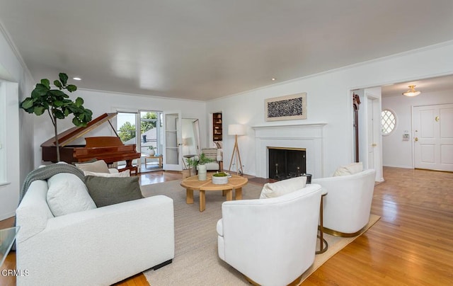 5210 La Canada Blvd, La Canada Flintridge, CA 91011 - living room featuring crown molding, light wood-style flooring, and a fireplace