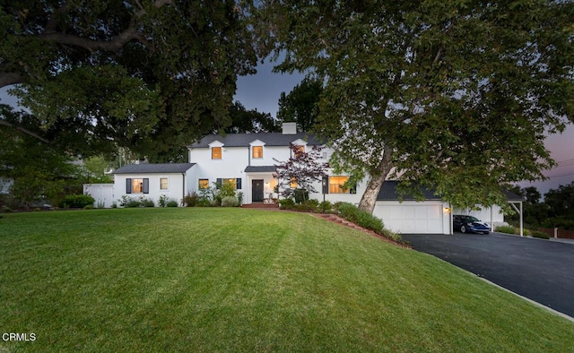 5210 La Canada Blvd, La Canada Flintridge, CA 91011 - modern farmhouse with driveway, a chimney, a front lawn, and an attached garage