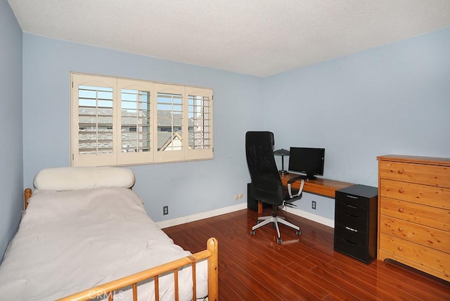 1201 W Cerritos Ave Unit 68, Anaheim, CA 92802 - bedroom with wood finished floors, a textured ceiling, and a desk
