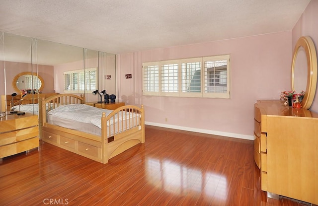 1201 W Cerritos Ave Unit 68, Anaheim, CA 92802 - bedroom featuring wood finished floors and a textured ceiling