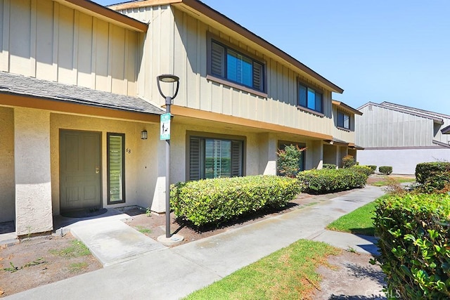 1201 W Cerritos Ave Unit 68, Anaheim, CA 92802 - view of front of property featuring board and batten siding and stucco siding