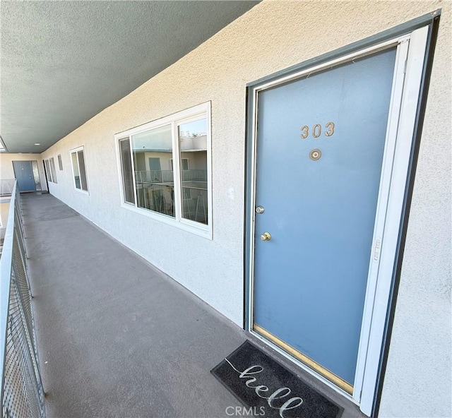 1126 N Central Ave Unit 303, Glendale, CA 91202 - doorway to property featuring a balcony and stucco siding