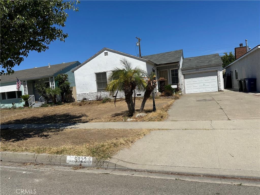 5322 Pearce Ave, Lakewood, CA 90712 - single story home featuring concrete driveway, a garage, and stucco siding