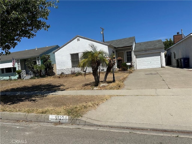 5322 Pearce Ave, Lakewood, CA 90712 - single story home featuring concrete driveway, a garage, and stucco siding