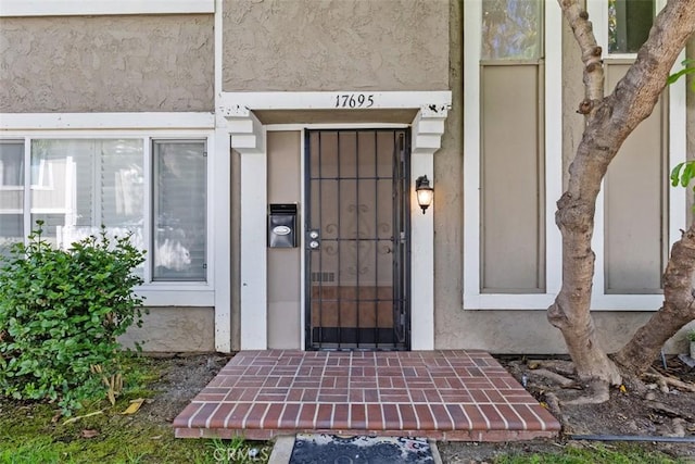 17695 Brittany Ln Unit 74, Huntington Beach, CA 92647 - property entrance with stucco siding
