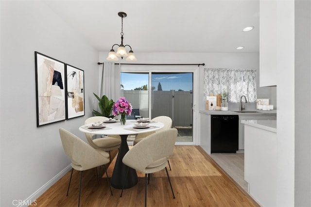 17695 Brittany Ln Unit 74, Huntington Beach, CA 92647 - dining space with light wood-style flooring, a chandelier, healthy amount of natural light, and recessed lighting