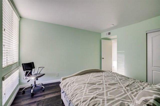 9920 Jordan Ave Unit 7, Chatsworth, CA 91311 - bedroom with multiple windows and wood finished floors
