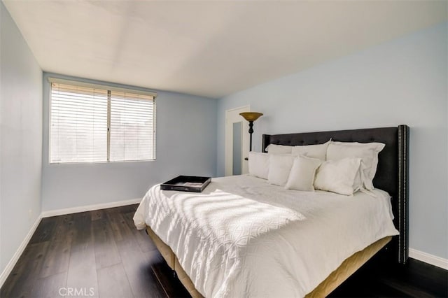 9920 Jordan Ave Unit 7, Chatsworth, CA 91311 - bedroom featuring baseboards and dark wood-style flooring