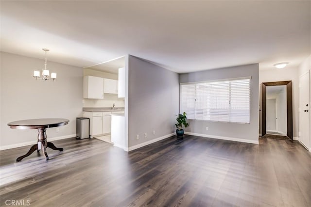 9920 Jordan Ave Unit 7, Chatsworth, CA 91311 - unfurnished living room featuring a chandelier and dark wood-type flooring