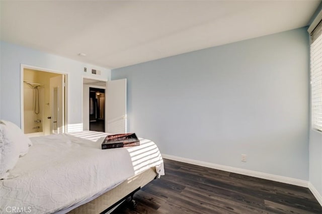 9920 Jordan Ave Unit 7, Chatsworth, CA 91311 - bedroom with dark wood finished floors and ensuite bath