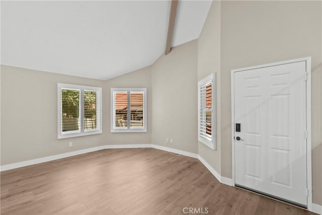 26337 Rainbow Glen Dr Unit 244, Newhall, CA 91321 - foyer featuring wood finished floors, high vaulted ceiling, and beam ceiling